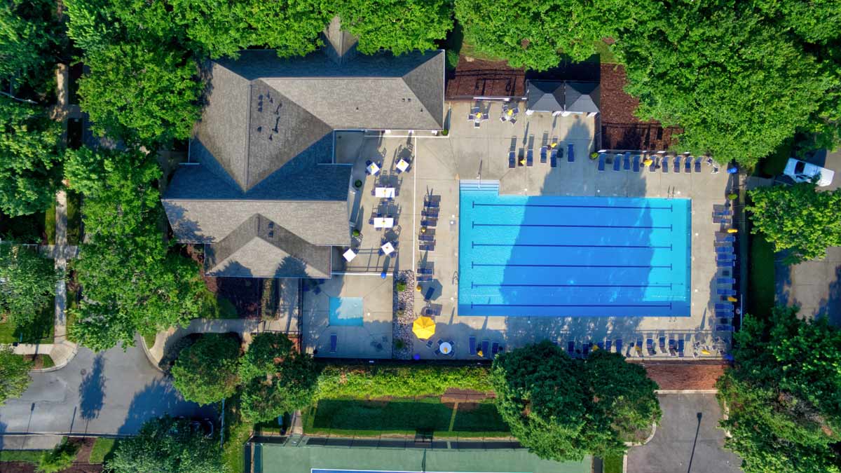 Birkdale-Greens-Village-community-pool beautiful aerial of Birkdale greens pool, clubhouse and tennis court homes for sale in birkdale village nearby