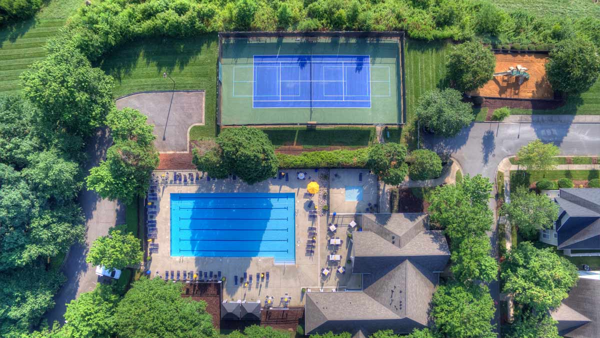 birkdale-greens-pools-tennisourts-playground beautiful aerial of Birkdale greens pool, clubhouse and tennis court